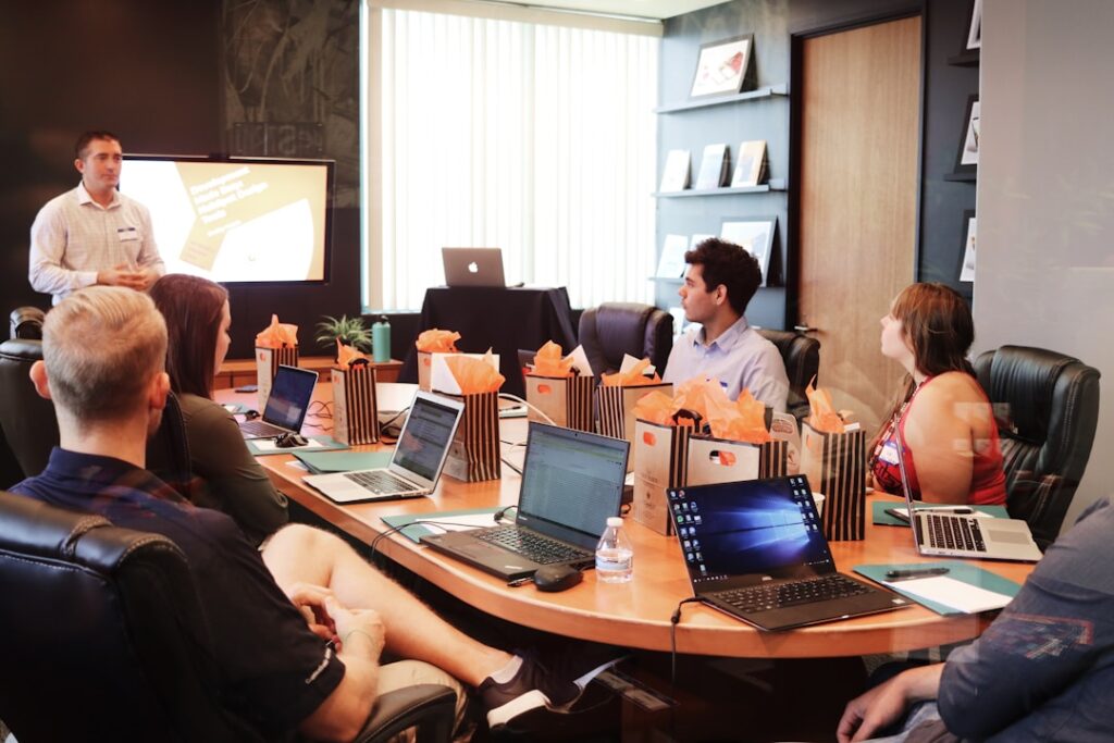 A team in an office discussing knowledge management during a meeting